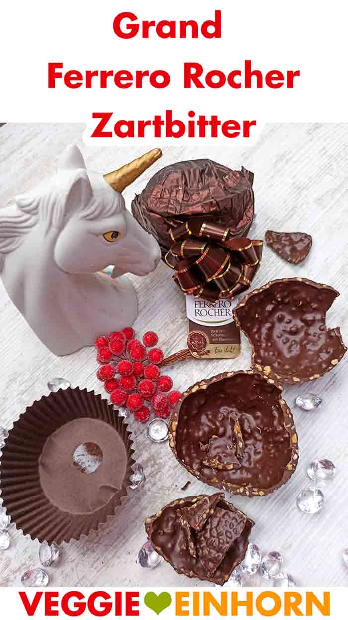 Zerbrochene Schokolade und die Verpackung des Grand Ferrero Rocher Zartbitter.