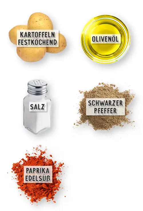Festkochende Kartoffeln, Olivenöl, Salz, schwarzer Pfeffer und edelsüßes Paprikapulver nebeneinander als Zutaten für Kartoffel Wedges dargestellt.
